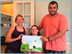 alt text= Sarah Eve and David hold a painting